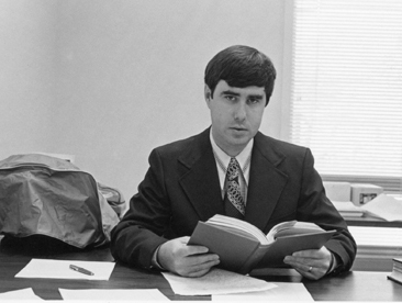 Perry Roquemore, 1974, at desk with book